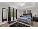 Spacious main bedroom with ceiling fan, large windows, and plush carpet at 8121 Roseville Blvd, Davenport, FL 33896