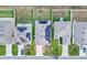 Aerial view of houses with solar panels on roofs at 965 Shady Tree Ln, Davenport, FL 33897