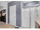 Bathroom with shower and gray walls at 965 Shady Tree Ln, Davenport, FL 33897