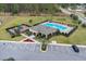 Community pool, playground, and parking area at 965 Shady Tree Ln, Davenport, FL 33897