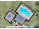 Aerial view of community pool, playground, and clubhouse at 965 Shady Tree Ln, Davenport, FL 33897