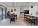 Kitchen with gray cabinets, a large island, and wood-look floors at 965 Shady Tree Ln, Davenport, FL 33897