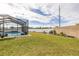 Spacious backyard with screened pool and fenced enclosure at 113 Promenade Ct, Auburndale, FL 33823