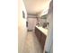 Bright bathroom with dual vanity sinks, tiled floors, and a shower-tub combo at 113 Promenade Ct, Auburndale, FL 33823