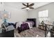 Charming bedroom with a double bed and a desk area at 113 Promenade Ct, Auburndale, FL 33823