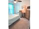 Serene bedroom featuring a ceiling fan, a desk area, and comfortable neutral carpet at 113 Promenade Ct, Auburndale, FL 33823