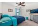 Bedroom with a double bed, ceiling fan, and dresser at 113 Promenade Ct, Auburndale, FL 33823