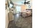 Bright bedroom featuring a large window, wood-look flooring, and a plush rug at 113 Promenade Ct, Auburndale, FL 33823