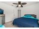 Bedroom with a double bed, ceiling fan, and built-in closet at 113 Promenade Ct, Auburndale, FL 33823
