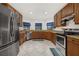 Modern kitchen with stainless steel appliances and granite counters at 113 Promenade Ct, Auburndale, FL 33823