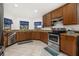 Modern kitchen with stainless steel appliances and granite counters at 113 Promenade Ct, Auburndale, FL 33823