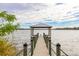 Private lakefront dock with covered seating area at 113 Promenade Ct, Auburndale, FL 33823