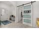 Convenient laundry room with barn door and washer/dryer at 113 Promenade Ct, Auburndale, FL 33823