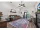 Relaxing living room with brown sofa, fireplace, and access to patio at 113 Promenade Ct, Auburndale, FL 33823