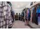 Large walk-in closet with ample hanging space and shelving at 113 Promenade Ct, Auburndale, FL 33823