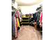 Spacious walk-in closet with ample storage, shelves, and clothing racks at 113 Promenade Ct, Auburndale, FL 33823