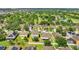 Aerial view of houses with solar panels and lush greenery at 137 Milestone Dr, Haines City, FL 33844