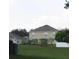 Rear view of two story house with fenced backyard at 137 Milestone Dr, Haines City, FL 33844