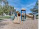 playground with slides and climbing structures at 137 Milestone Dr, Haines City, FL 33844