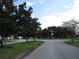 Residential street view with houses and trees at 137 Milestone Dr, Haines City, FL 33844
