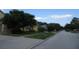 Residential street view with houses and trees at 137 Milestone Dr, Haines City, FL 33844