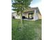 Relaxing backyard patio with outdoor seating, grill, and sliding glass doors to seamlessly blend indoor-outdoor living at 14827 Milfoil Ave, Orlando, FL 32827