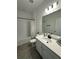 Clean bathroom with a bathtub, shower, and modern vanity at 14827 Milfoil Ave, Orlando, FL 32827