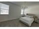 Bright bedroom with king-size bed and large windows at 14827 Milfoil Ave, Orlando, FL 32827