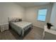 Cozy bedroom with a queen-size bed and light decor at 14827 Milfoil Ave, Orlando, FL 32827