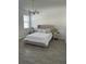 Spacious bedroom with king-size bed and modern decor at 14827 Milfoil Ave, Orlando, FL 32827