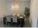Modern dining room with statement wall and chandelier at 14827 Milfoil Ave, Orlando, FL 32827
