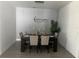 Modern dining room with statement wall and chandelier at 14827 Milfoil Ave, Orlando, FL 32827