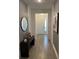 Bright entryway with wood-look tile floors and a console table at 14827 Milfoil Ave, Orlando, FL 32827