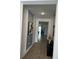 Bright and spacious entryway with modern wall art and tile flooring at 14827 Milfoil Ave, Orlando, FL 32827