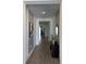 Bright entryway with wood-look tile floors and a console table at 14827 Milfoil Ave, Orlando, FL 32827