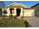 One-story house with a two-car garage and landscaping at 14827 Milfoil Ave, Orlando, FL 32827