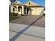 One-story home with a two-car garage and a brick paver driveway at 14827 Milfoil Ave, Orlando, FL 32827