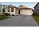 Two-story house with a two-car garage at 14827 Milfoil Ave, Orlando, FL 32827