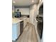 Modern kitchen with stainless steel appliances and white cabinets at 14827 Milfoil Ave, Orlando, FL 32827