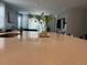 Bright kitchen with expansive island and view to living room at 14827 Milfoil Ave, Orlando, FL 32827