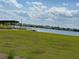 Serene lakefront view with grassy area at 14827 Milfoil Ave, Orlando, FL 32827