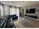 Spacious living room with comfortable seating and large windows at 14827 Milfoil Ave, Orlando, FL 32827