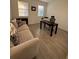 Bright office with wood floors, desk, and sofa at 14827 Milfoil Ave, Orlando, FL 32827