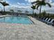 Community pool with plenty of lounge chairs for relaxing at 14827 Milfoil Ave, Orlando, FL 32827