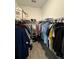 Large walk-in closet with ample shelving and hanging space at 14827 Milfoil Ave, Orlando, FL 32827