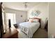 Bedroom with a queen-size bed and ceiling fan at 2511 La Jolla Trl, Kissimmee, FL 34747