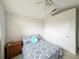 Bedroom with double bed, ample closet space, and ceiling fan at 2511 La Jolla Trl, Kissimmee, FL 34747