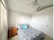 Bedroom with double bed, ample closet space, and ceiling fan at 2511 La Jolla Trl, Kissimmee, FL 34747