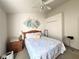 Bedroom with a queen-size bed and ceiling fan at 2511 La Jolla Trl, Kissimmee, FL 34747
