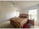 Large bedroom with a king-size bed and ceiling fan at 2511 La Jolla Trl, Kissimmee, FL 34747